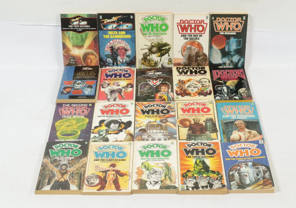 Vectis Auction Lot 15/9/26: Target Books, a group of twenty Doctor Who paperback books. The lot comprises: • Doctor Who - The Twin Dilemma • Doctor Who - Delta and the Bannermen • Doctor Who and the Green Death • Doctor Who and the Day of the Daleks • Doctor Who - The Invasion • Doctor Who - The Evil of the Daleks • Doctor Who and the Pyramids of Mars • Doctor Who - Vengeance on Varos • Doctor Who and the Doomsday Weapon • Doctor Who and the Revenge of the Cybermen • The Second Doctor Who Quiz Book • Doctor Who - Death to the Daleks • Doctor Who and the Genesis of the Daleks • Doctor Who and the Visitation • Doctor Who and the Daemons • plus others Condition appears Fair to Good.