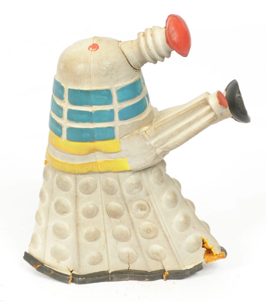 Newfield Ltd. Doctor Who vintage Bendy Dalek, 1965 – a rare bendable foam rubber figure finished in off-white with turquoise and yellow midsection bands and red detailing. It is in deteriorating condition. Condition appears Fair to Good.